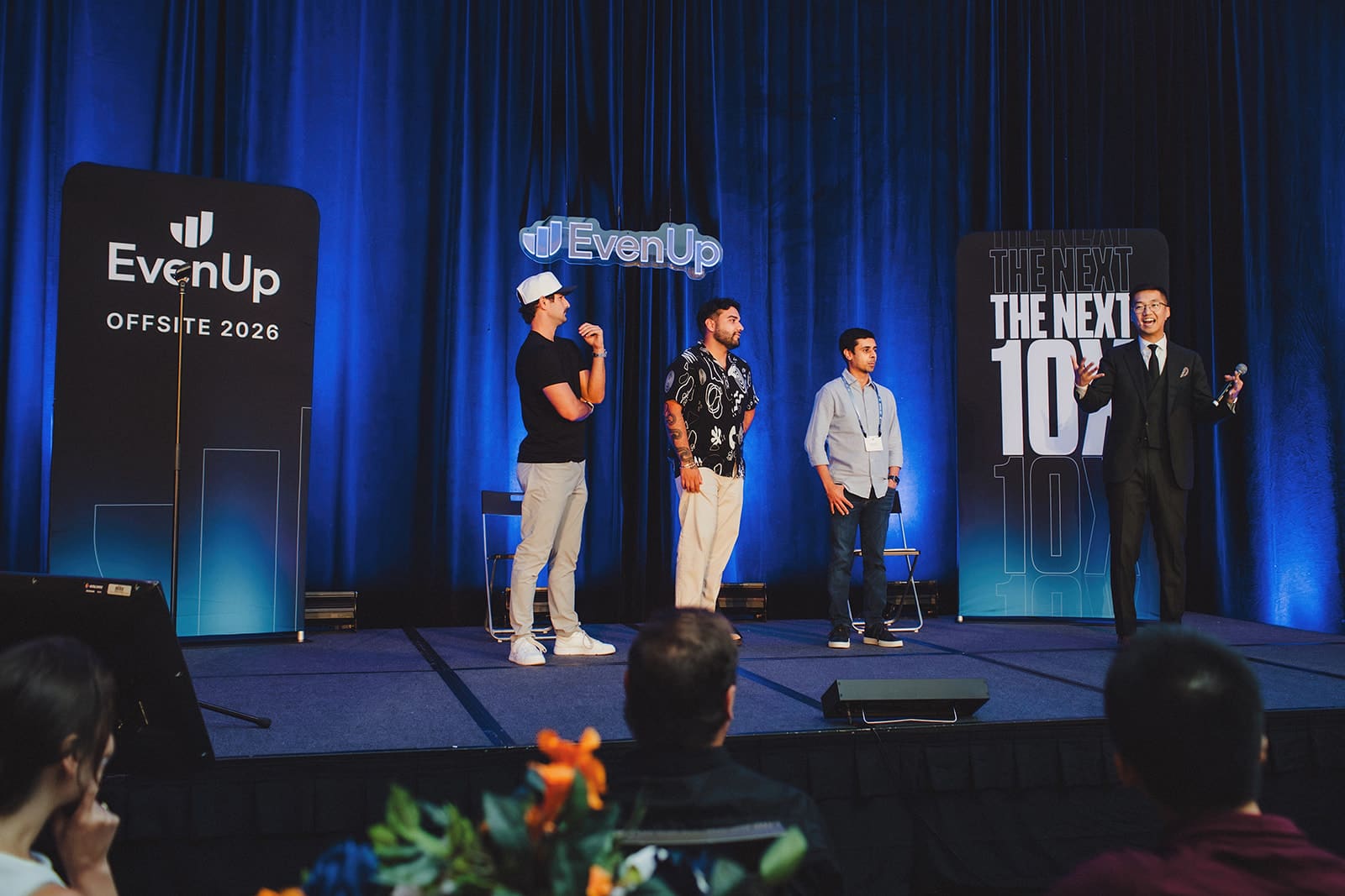 Three EvenUp guests on stage with Bao in front of the EvenUp Offsite 2026 backdrop