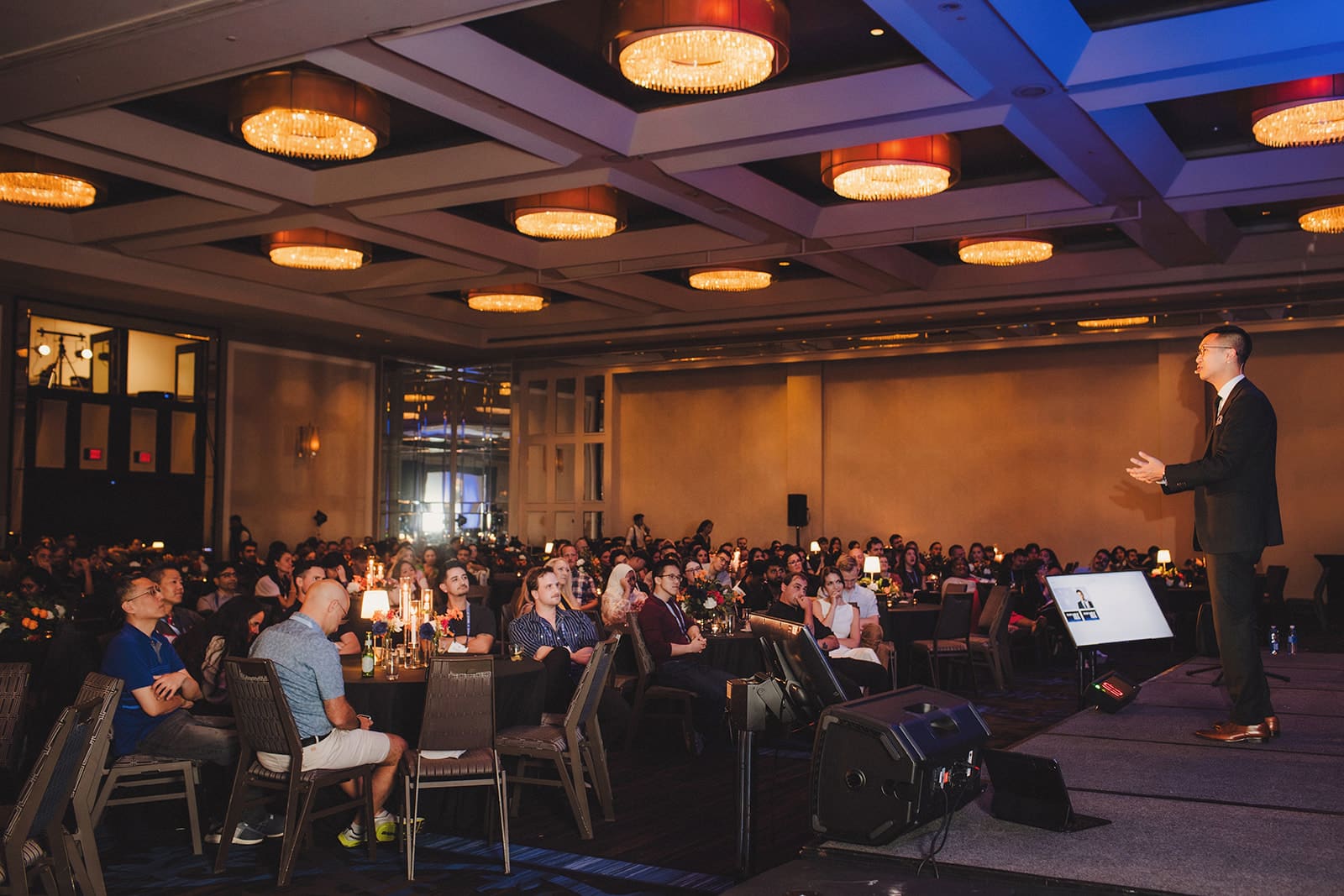 Bao Magic on stage in the ballroom at Le Centre Sheraton Montreal with nearly 500 EvenUp guests seated at round tables